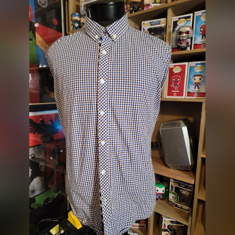 UG shirt, purple, white and brown checkered.